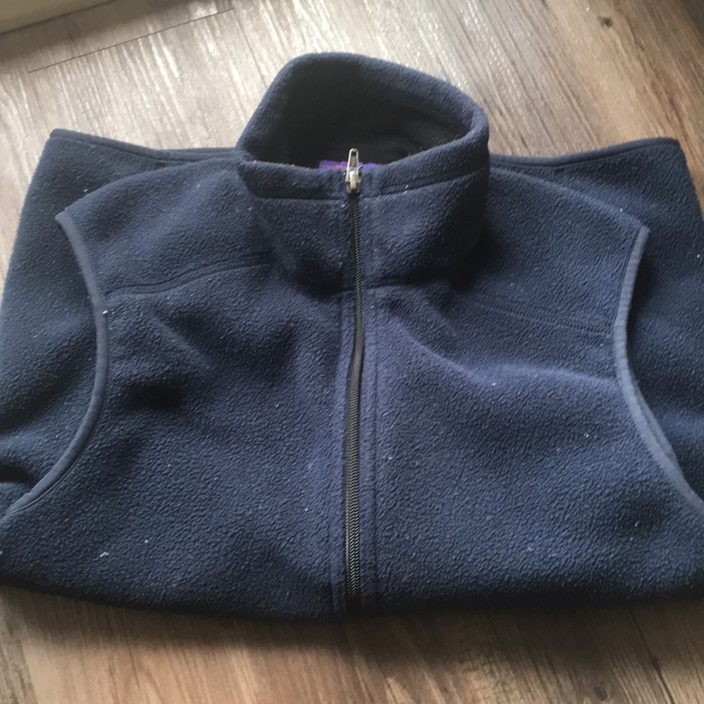 Men’s small Patagonia Synchilla vest in navy blue.